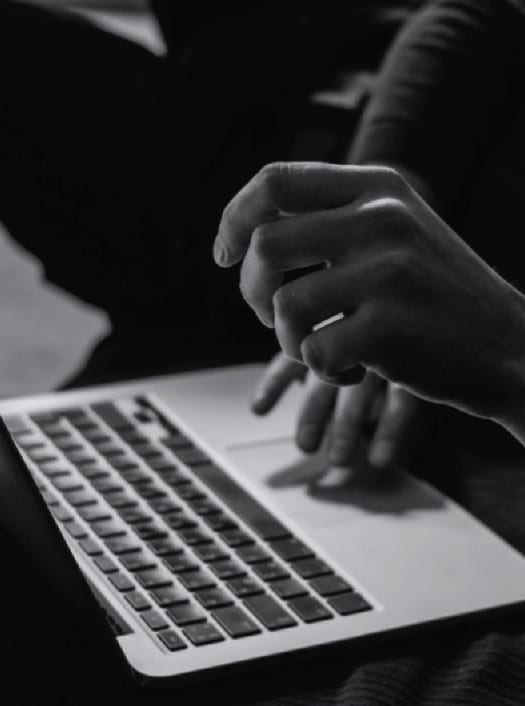 close up of hands laptop keyboard